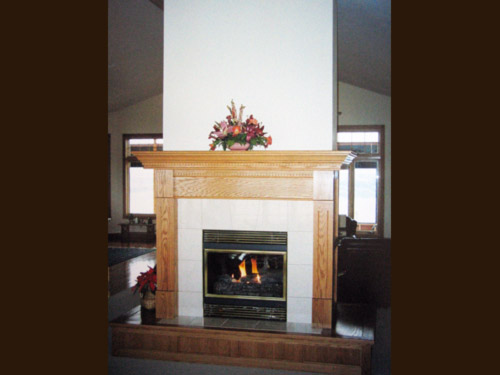 Picture 2 of 6, wood framed fireplace.
