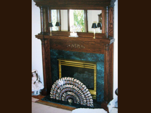 Picture 4 of 6, a marble fireplace with an maple frame.